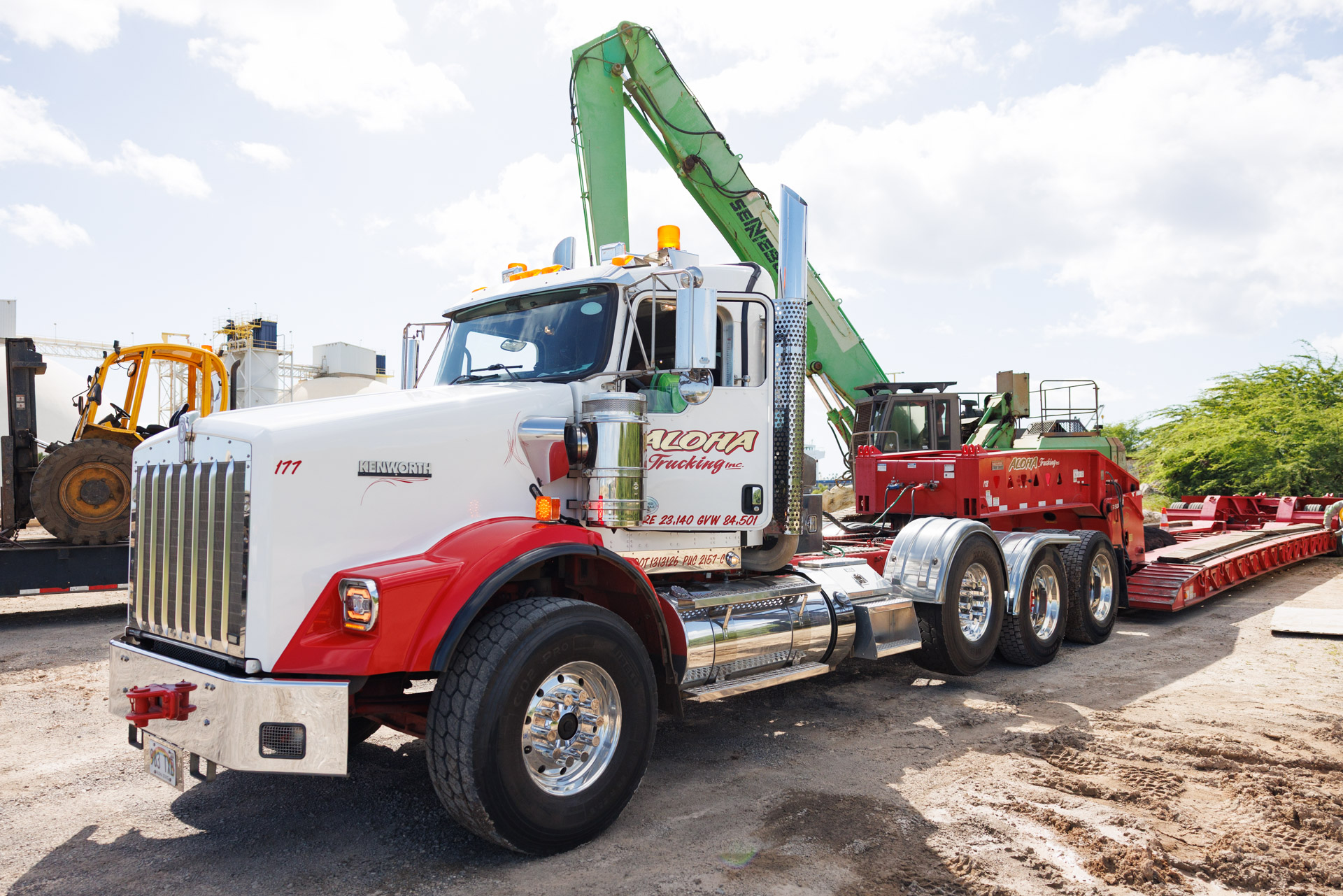A Peterbilt 379 commercial truck performing heavy-duty aggregate hauling at an Oahu construction site.